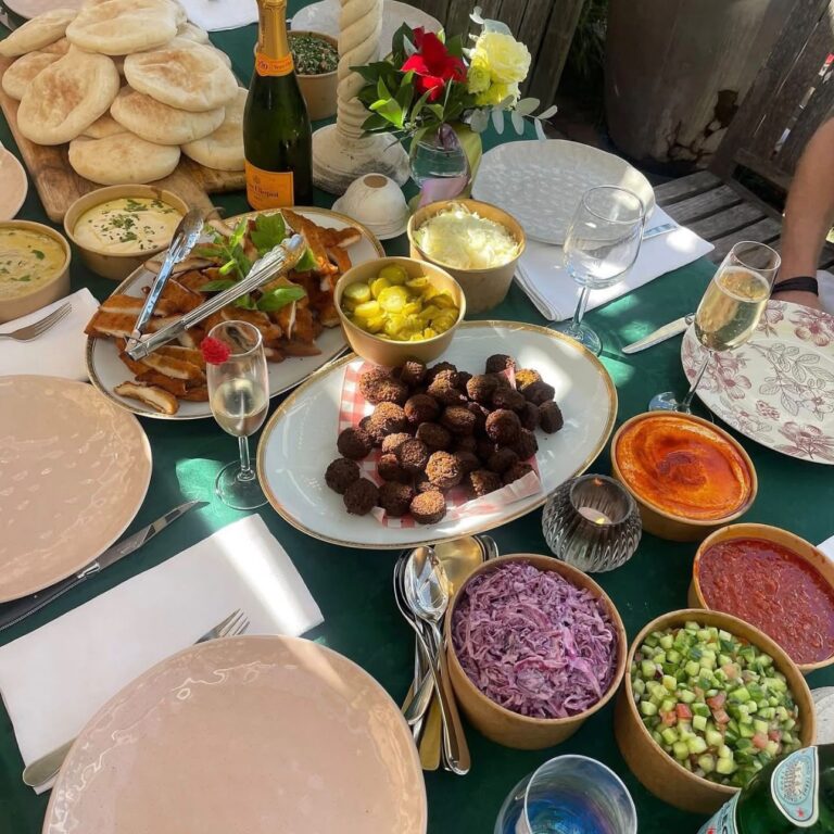 Falafel, hummus and fresh salads laid out for a Chapter E catering order